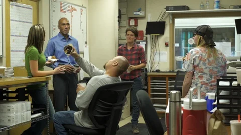 Colleagues talking in office with refreshments. 動画素材 88028256