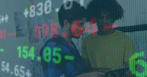 Colleagues tapping tablet and comparing floating financial figures while Stock Footage 314707028