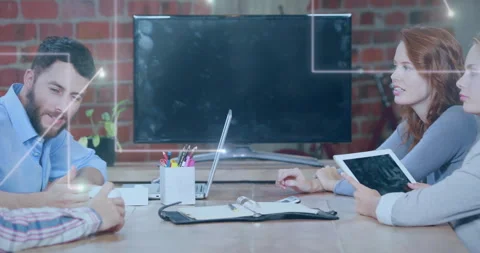Colleagues tapping tablet and discussing project with glowing lines overlaying Stock Footage 315560019