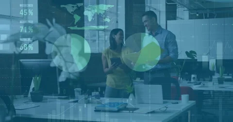 Colleagues tapping tablet and holding folder activating finance data charts for Stock Footage 309721147