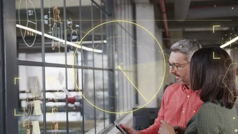 Colleagues tapping tablet and pointing at yellow circle, shifting radial pointer 스톡 동영상 333950082