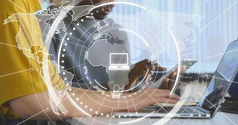 Colleagues tapping tablet and typing laptop, initiating map HUD overlay, working Stock Photos