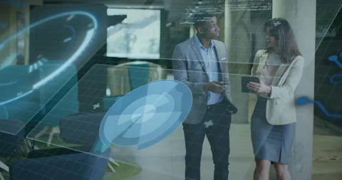 Colleagues tapping tablet launching tech hologram comparing phone data while Stock Footage 315544099