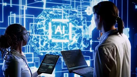 Colleagues update AI systems 스톡 사진