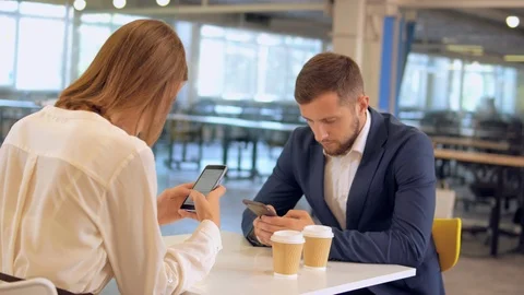 Colleagues use gadget at lunch time Stock Footage 101466870