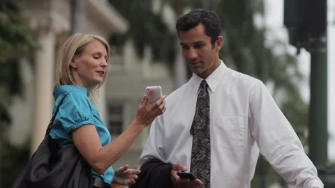 Colleagues using smart phones. Stock Footage 88371198