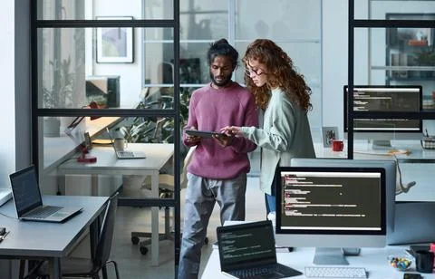 Colleagues using tablet pc in their work Stock Photos