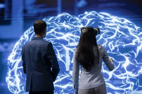 Colleagues using virtual reality technology and AI systems 写真素材
