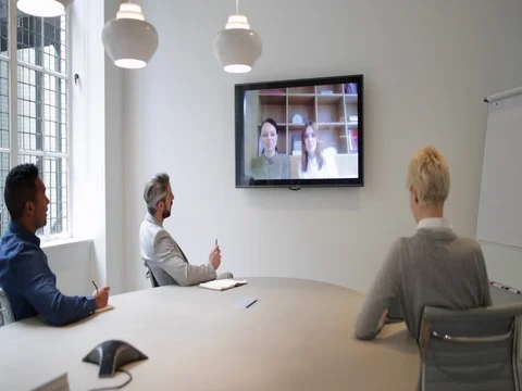 Colleagues on a video conference call in a business meeting Stock Footage