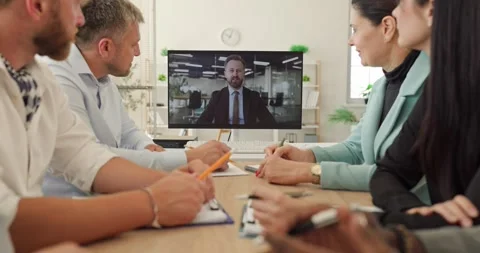 Colleagues Watching Remote Business Presentation During Online Team Meeting Stock Footage 345418365