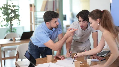 Colleagues work on paper drawing, making sketches while discussing construction Stock Footage 341385265
