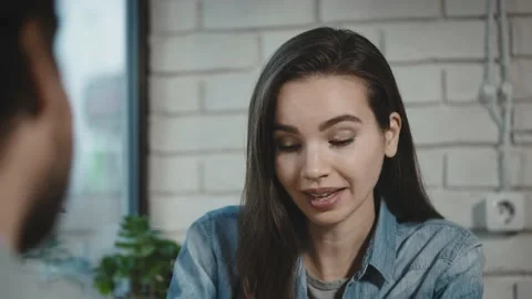 Colleagues from work went to have a bite to eat in a city cafe. A man and a Stock Footage 226922420
