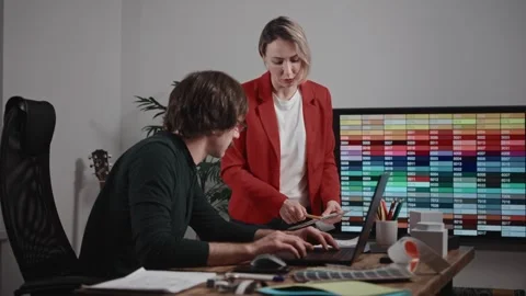 Colleagues working in a design and architecture studio. A woman interior Stock Footage 283346094