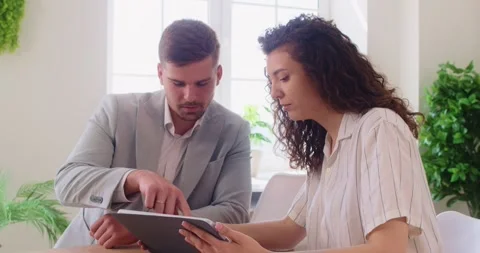 Colleagues Working With Documents In Office Meeting Stock Footage 337833512