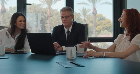 Colleagues working on an exciting new project using a computer. Stock Footage 139917471