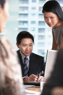 Colleagues Working On Laptop Stock Photos