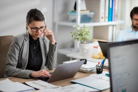 Colleagues working at office Stock Photos