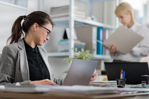 Colleagues working at office Stock Photos