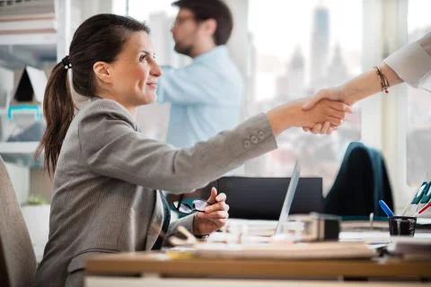 Colleagues working at office Stock Photos