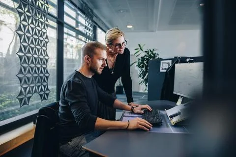 Colleagues working in office Stock Photos