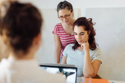 Colleagues working on project around table Stock Photos