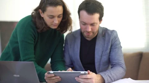 Colleagues working together with digital tablet Stock Footage 75413053