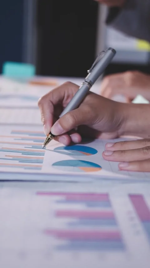 Colleagues working together pointing at business documents during meeting. Stock Footage 344917564