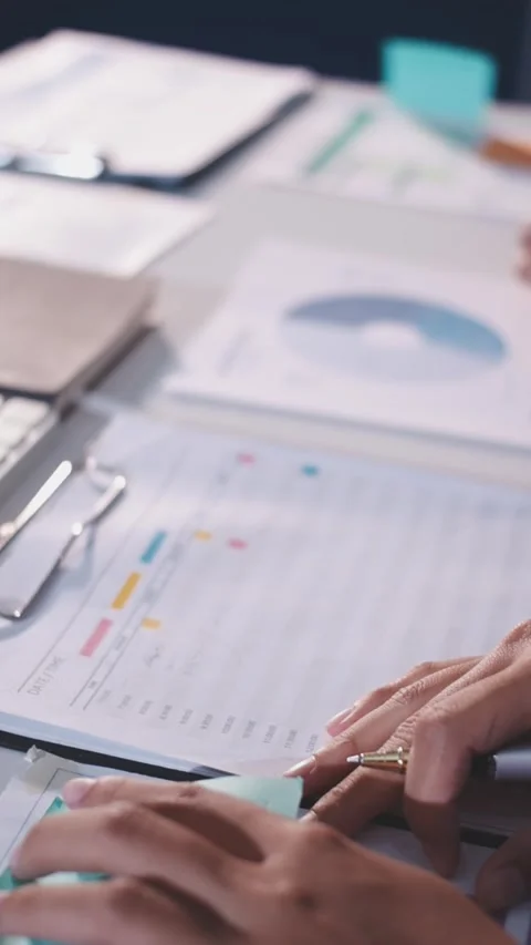 Colleagues working together pointing at business documents during meeting. Stock Footage 344917567