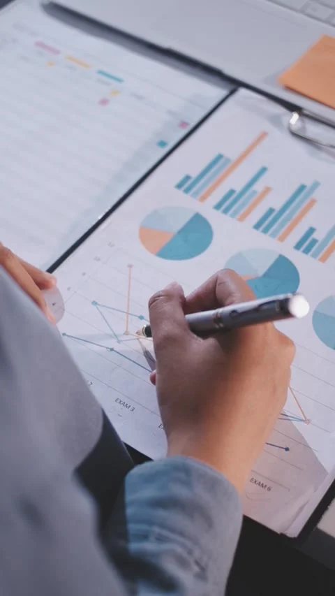 Colleagues working together pointing at business documents during meeting. Stock Footage 344919296