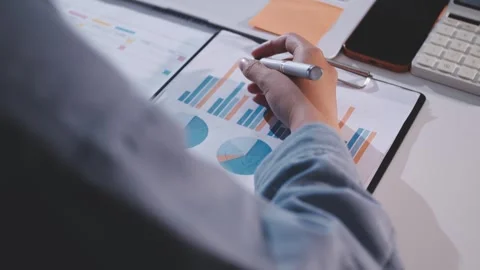 Colleagues working together pointing at business documents during meeting. Stock Footage 344919384