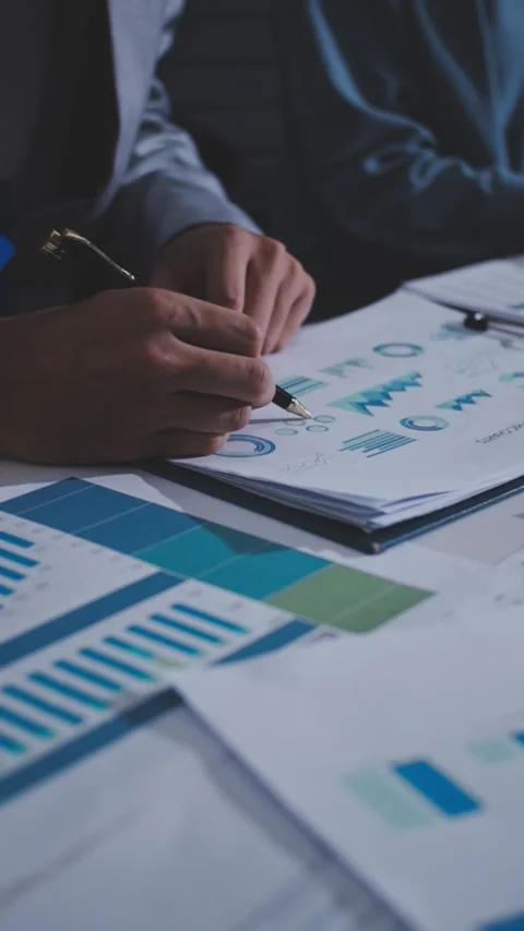 Colleagues working together pointing at business documents during meeting. Stock Footage 344919486