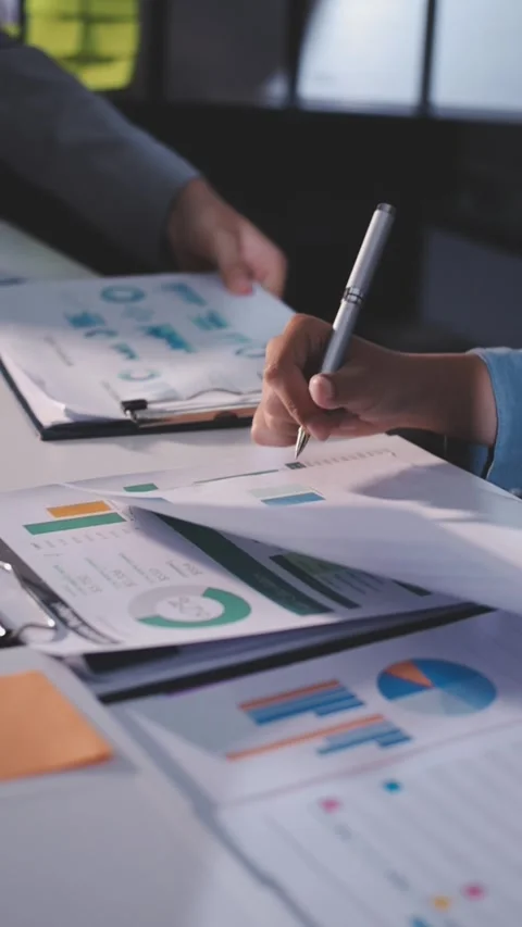 Colleagues working together pointing at business documents during meeting. Stock Footage 344919503