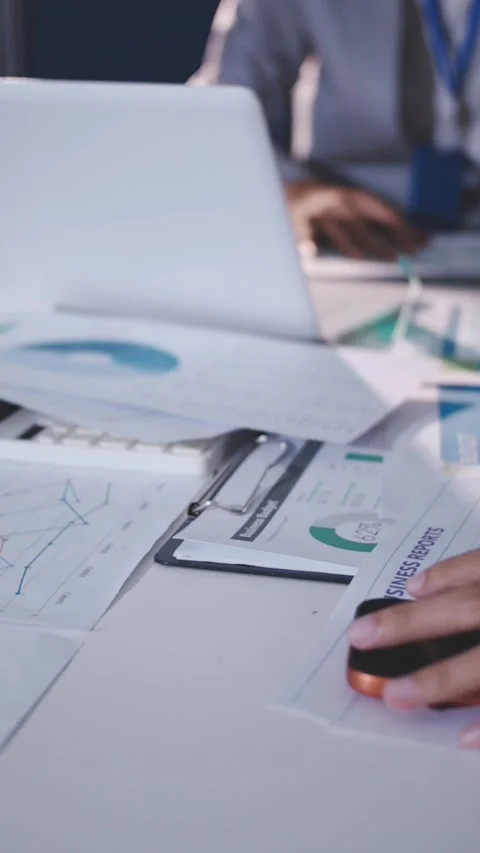 Colleagues working together pointing at business documents during meeting. Stock Footage 344919509