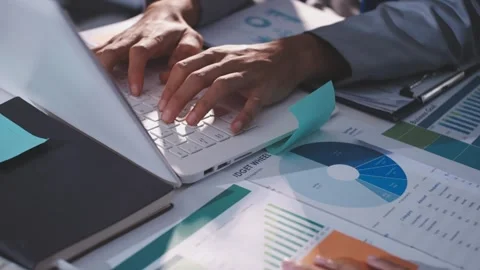 Colleagues working together pointing at business documents during meeting. Stock Footage 344919642