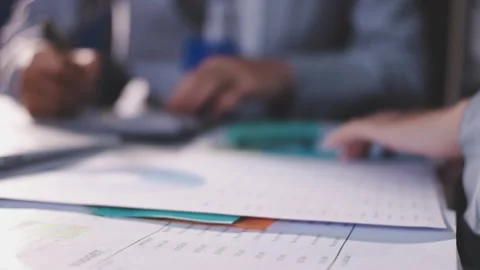 Colleagues working together pointing at business documents during meeting. Stock Footage 344919836