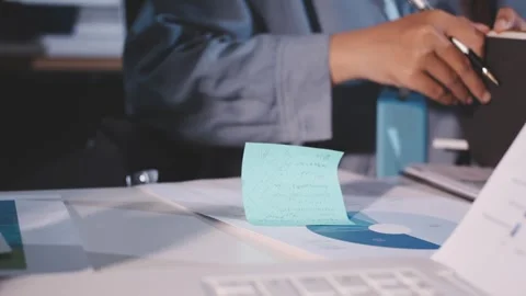 Colleagues working together pointing at business documents during meeting. Stock Footage 344920022