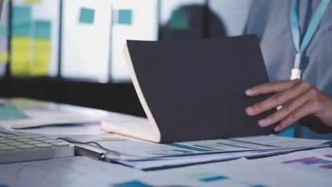 Colleagues working together pointing at business documents during meeting. Stock Footage 344920042