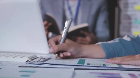 Colleagues working together pointing at business documents during meeting. Stock Footage 344920050