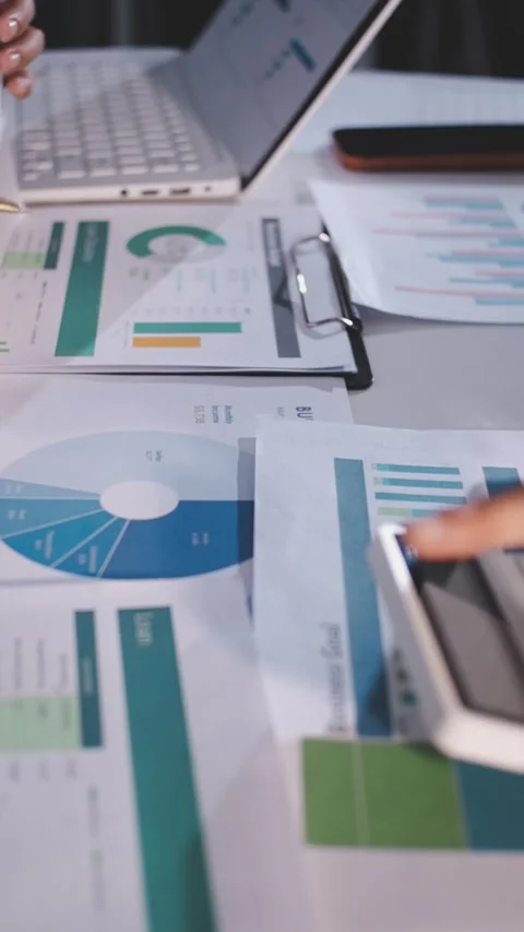 Colleagues working together pointing at business documents during meeting. Stock Footage 344920055