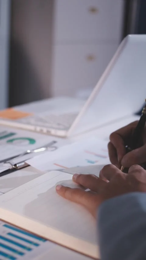 Colleagues working together pointing at business documents during meeting. Stock Footage 344920057