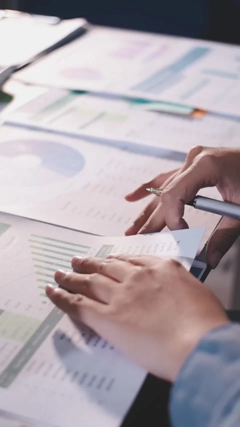 Colleagues working together pointing at business documents during meeting. Stock Footage 344920405