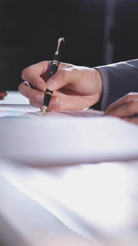 Colleagues working together pointing at business documents during meeting. Stock Footage 344920446