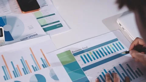 Colleagues working together pointing at business documents during meeting. Stock Footage 344920502