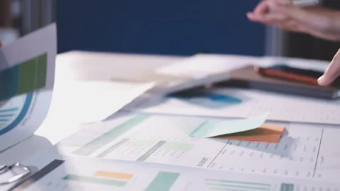 Colleagues working together pointing at business documents during meeting. Stock Footage 344920791