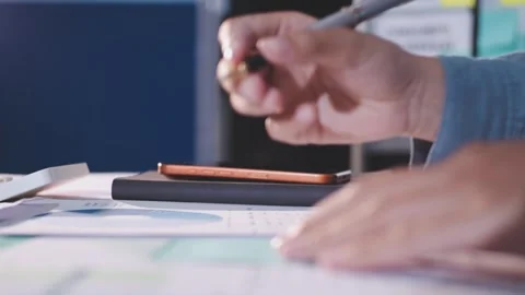 Colleagues working together pointing at business documents during meeting. Stock Footage 344920986