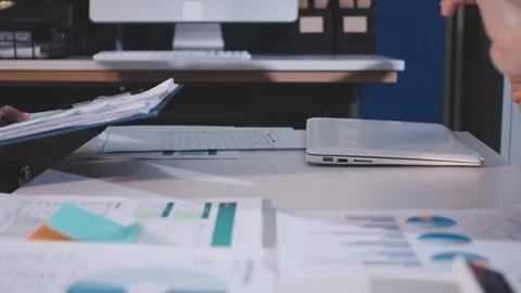 Colleagues working together pointing at business documents during meeting. Stock Footage 344921006