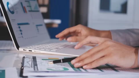 Colleagues working together pointing at business documents during meeting. Stock Footage 344921013