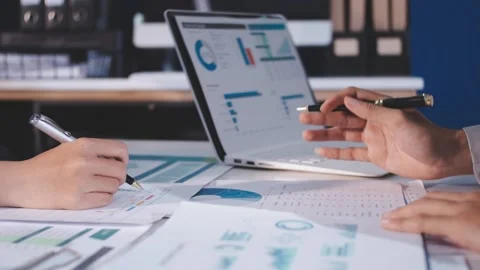 Colleagues working together pointing at business documents during meeting. Stock Footage 344921209