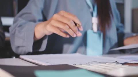 Colleagues working together pointing at business documents during meeting. Stock Footage 344922254