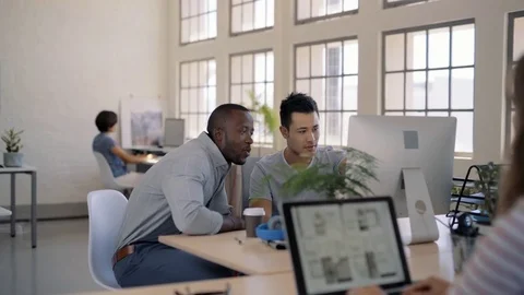 Colleagues working together on project Stock Footage 71628060